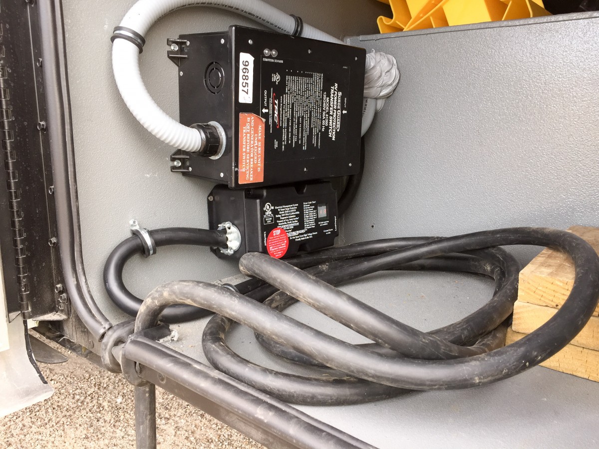 Progressive unit mounted to the compartment wall.