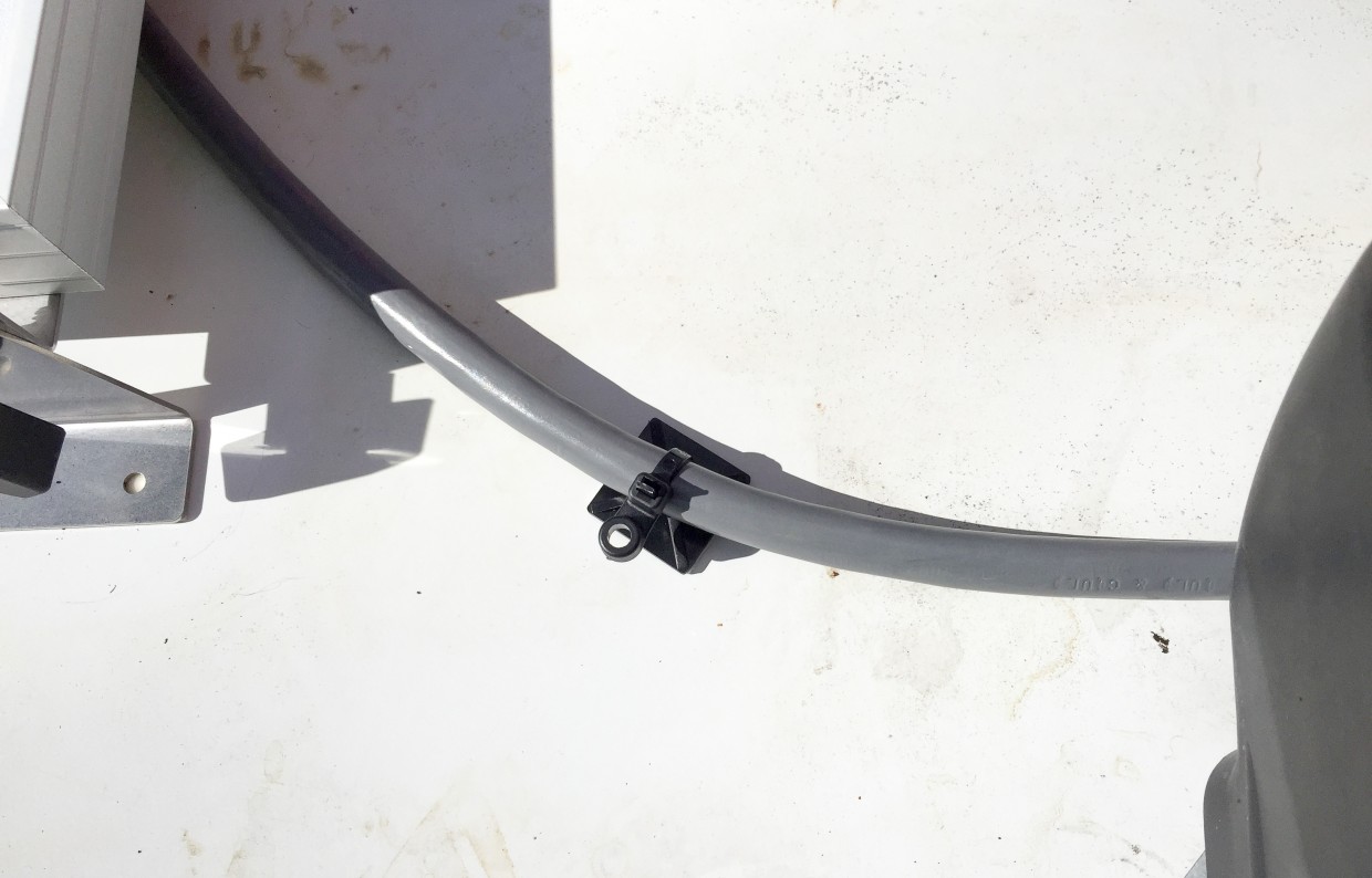 Rooftop solar cable secured in place.