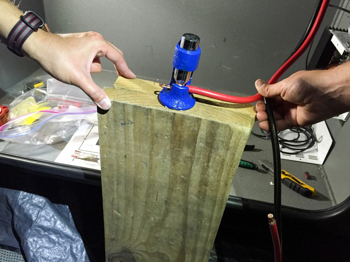 Installing lug ring connectors on the cables.