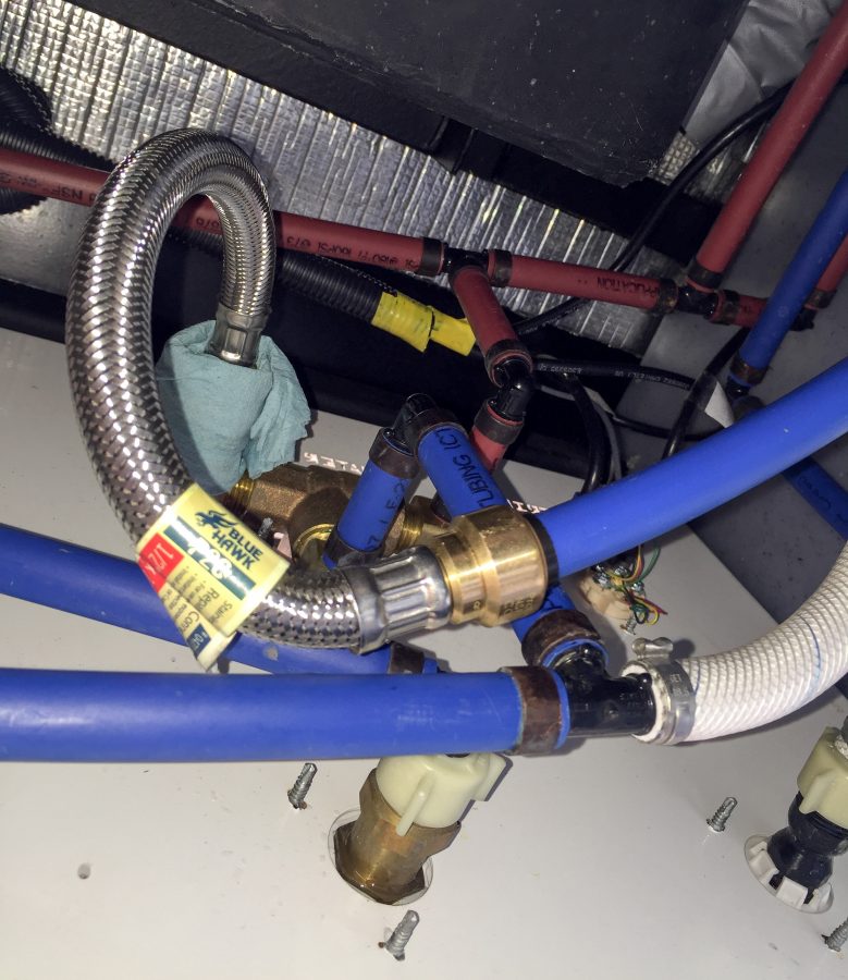 New flexible pipe section installed in place of elbow.